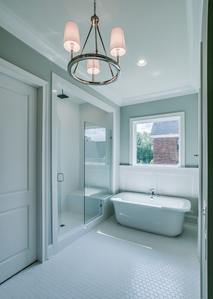 Design ideas for a mid-sized country master bathroom in Nashville with shaker cabinets, white cabinets, a freestanding tub, a curbless shower, white tile, subway tile, green walls, vinyl floors, an undermount sink and granite benchtops.