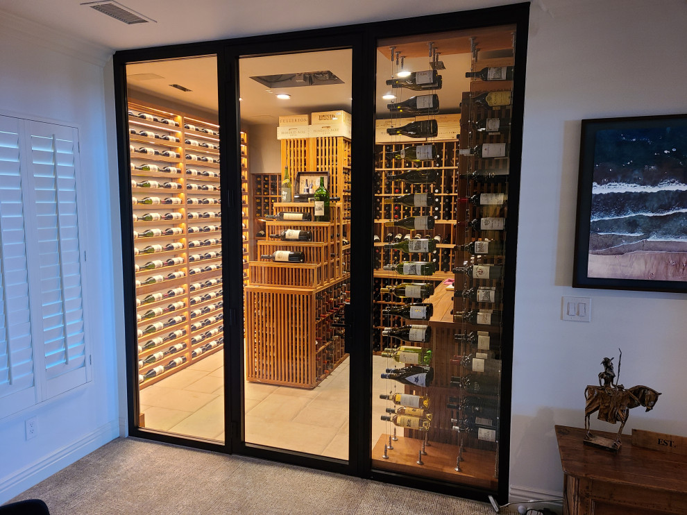 Design ideas for a large transitional wine cellar in Los Angeles with storage racks.