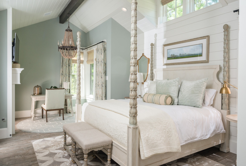 Design ideas for a large traditional master bedroom in Houston with blue walls, medium hardwood floors, brown floor, timber and planked wall panelling.