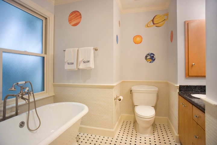 This is an example of a mid-sized contemporary kids bathroom in Houston with an undermount sink, flat-panel cabinets, light wood cabinets, marble benchtops, a claw-foot tub, a two-piece toilet, white tile, ceramic tile, blue walls and ceramic floors.