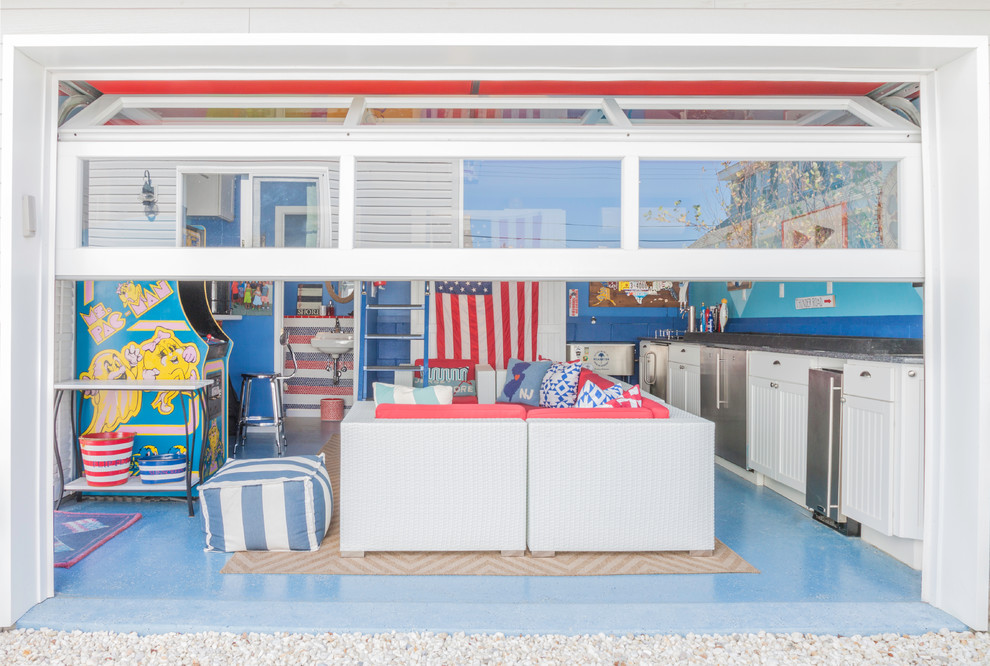 This is an example of a mid-sized beach style attached two-car workshop in New York.