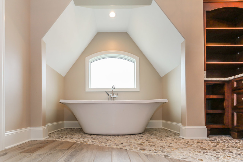 Design ideas for a large traditional kids bathroom in Chicago with dark wood cabinets, an alcove tub, a shower/bathtub combo, gray tile, ceramic tile, beige walls, ceramic floors, an undermount sink and engineered quartz benchtops.