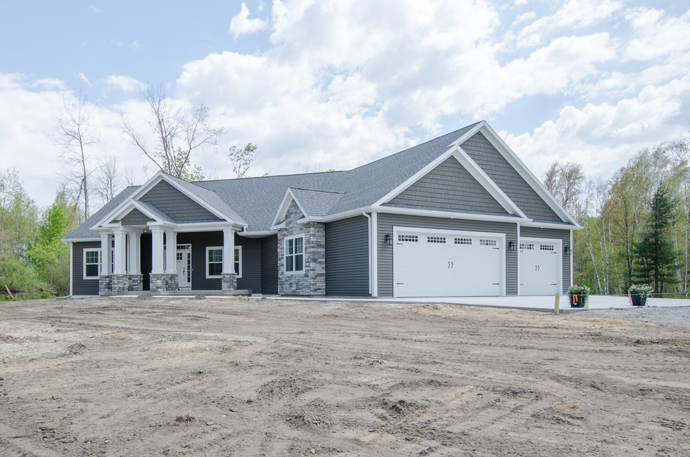 Mid-sized transitional gray one-story mixed siding gable roof photo with a shingle roof