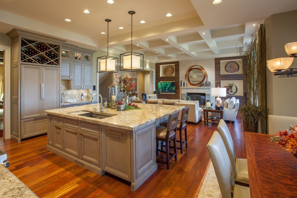 Open concept kitchen - large transitional medium tone wood floor open concept kitchen idea with recessed-panel cabinets, gray cabinets, granite countertops, beige backsplash, paneled appliances and an island