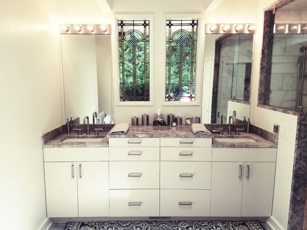 Photo of a mid-sized traditional master bathroom in Nashville with flat-panel cabinets, white cabinets, a corner shower, beige walls, an undermount sink, granite benchtops, grey floor and an open shower.