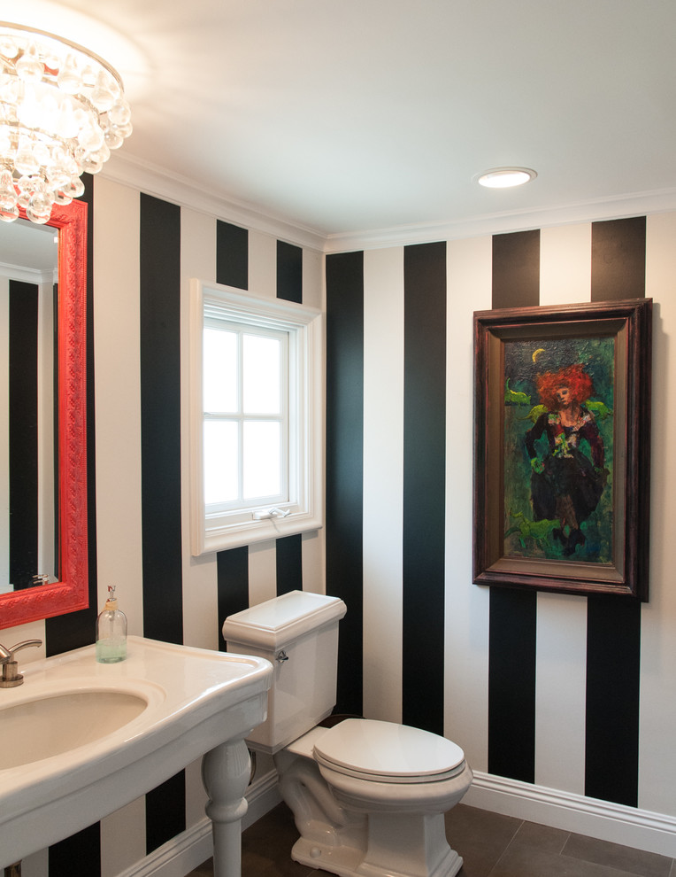 Transitional powder room in Orange County with a console sink.