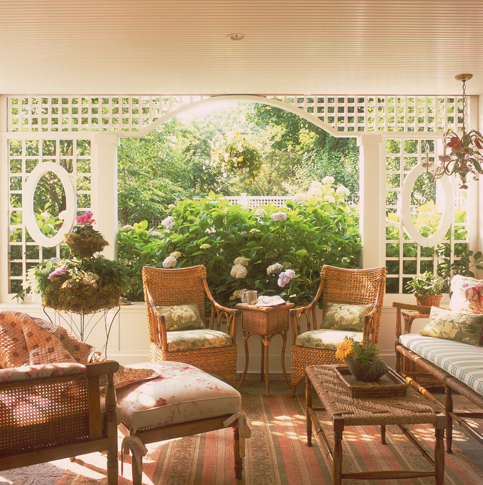 Design ideas for a mid-sized traditional backyard screened-in verandah in New York with a roof extension.