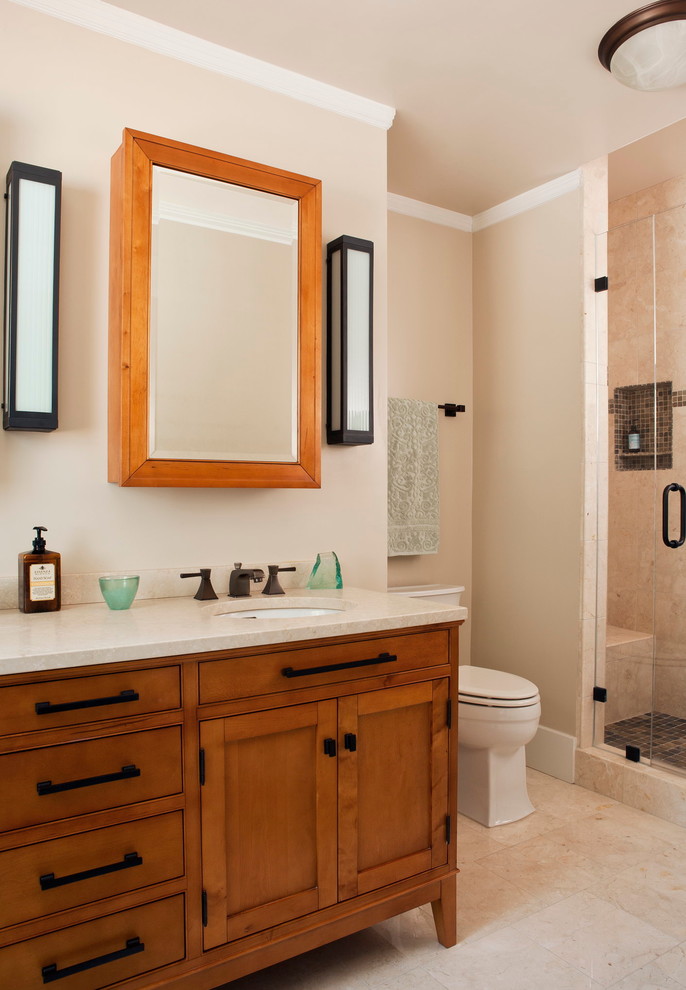 Mid-sized transitional 3/4 bathroom in San Francisco with shaker cabinets, dark wood cabinets, an alcove shower, a two-piece toilet, beige tile, porcelain tile, beige walls, porcelain floors, an undermount sink, engineered quartz benchtops, beige floor, a hinged shower door and beige benchtops.