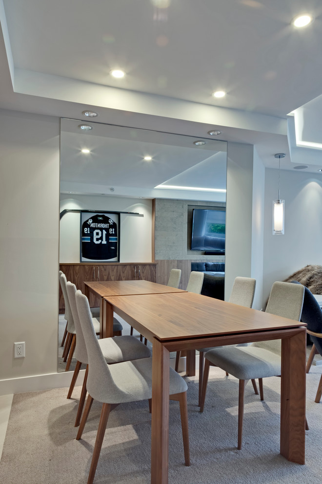 Photo of a mid-sized contemporary open plan dining in Vancouver with white walls, carpet and no fireplace.