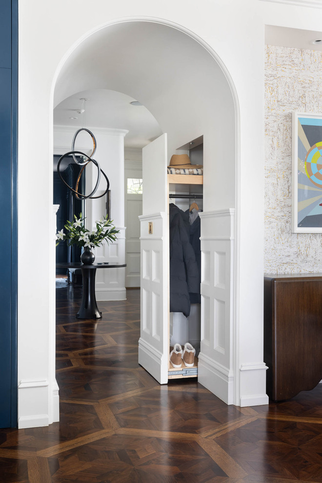 Inspiration for an expansive transitional entryway in San Francisco with medium hardwood floors, multi-coloured floor and panelled walls.