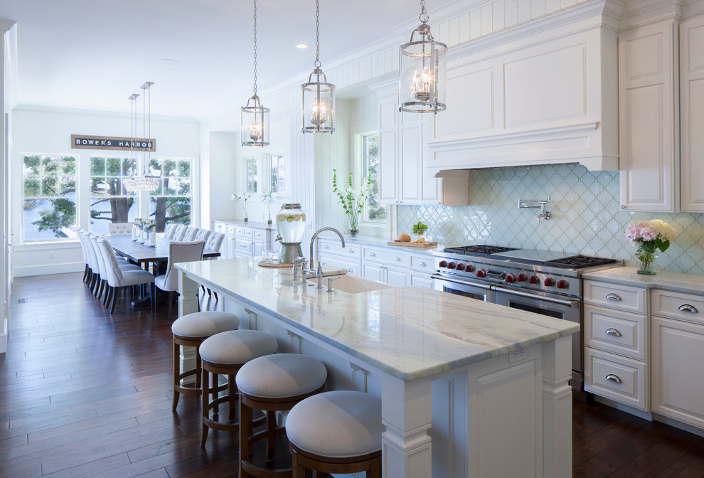This is an example of a large traditional eat-in kitchen in Other with dark hardwood floors.