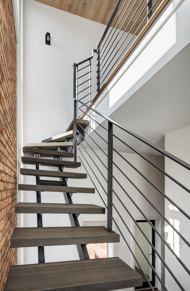 Photo of a mid-sized contemporary wood floating staircase in Chicago with open risers.