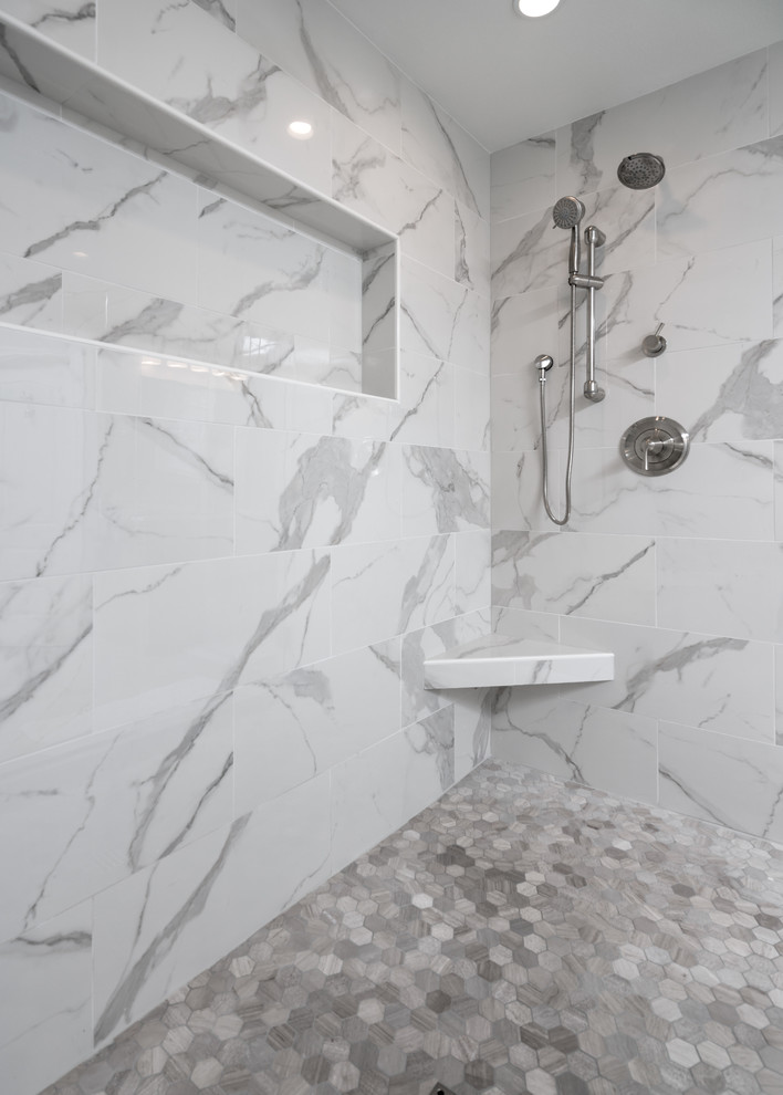 Large transitional master multicolored tile and mosaic tile porcelain tile double shower photo with gray walls, an undermount sink and quartz countertops