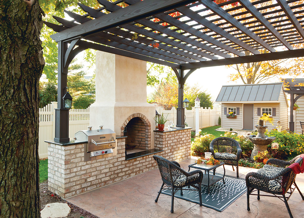 Inspiration for a mid-sized traditional backyard patio in Philadelphia with a fire feature and a pergola.