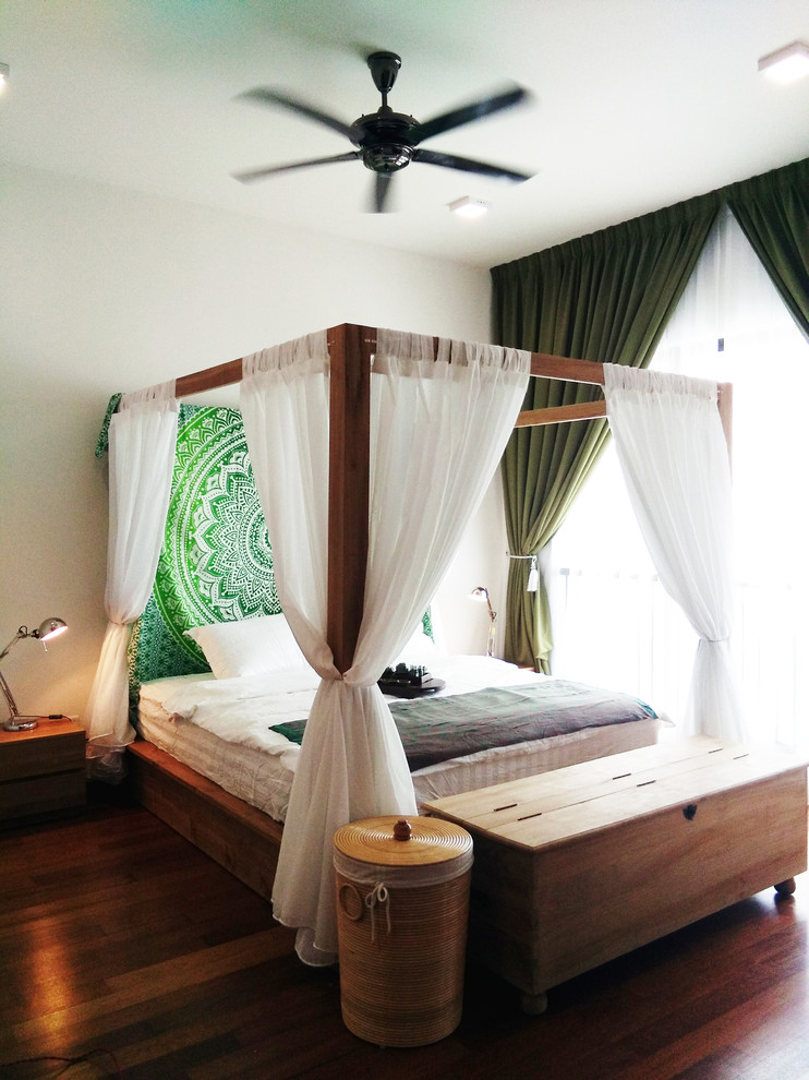 Example of a mid-sized island style master laminate floor and brown floor bedroom design with white walls