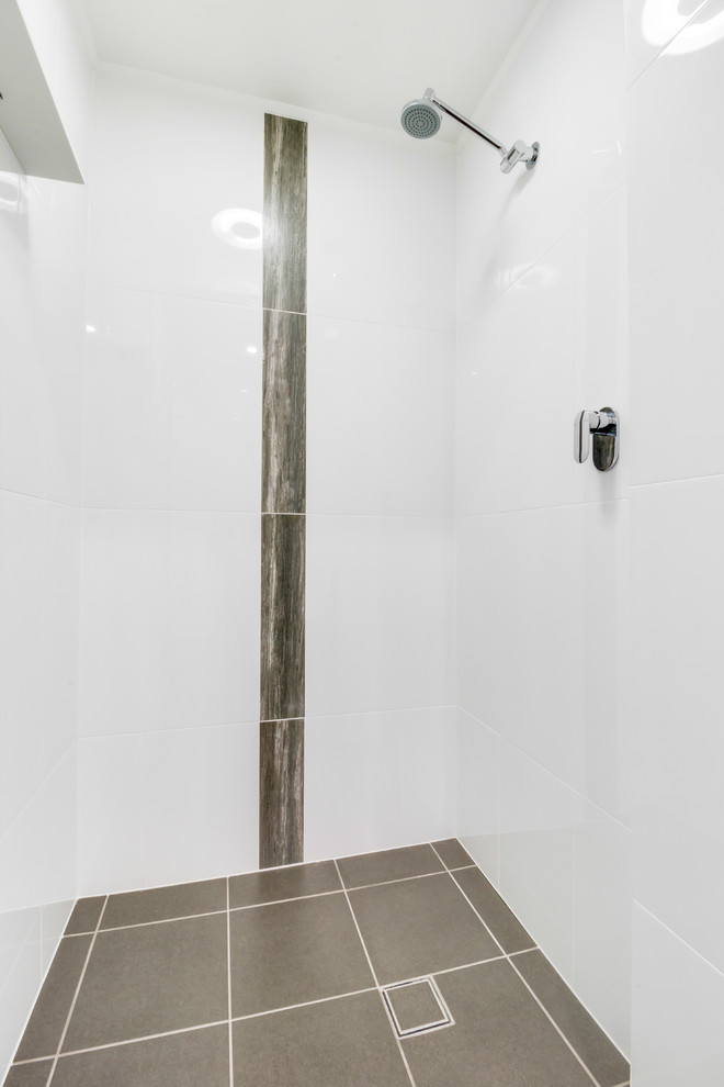 Large modern master wet room bathroom in Adelaide with shaker cabinets, white cabinets, granite benchtops, a freestanding tub, a two-piece toilet, white tile, ceramic tile, white walls, ceramic floors, a vessel sink, brown floor, a hinged shower door and brown benchtops.