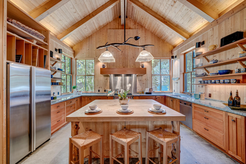 Inspiration for a country u-shaped kitchen in Other with an undermount sink, shaker cabinets, medium wood cabinets, beige splashback, timber splashback, concrete floors, with island, grey floor, grey benchtop, vaulted and wood.