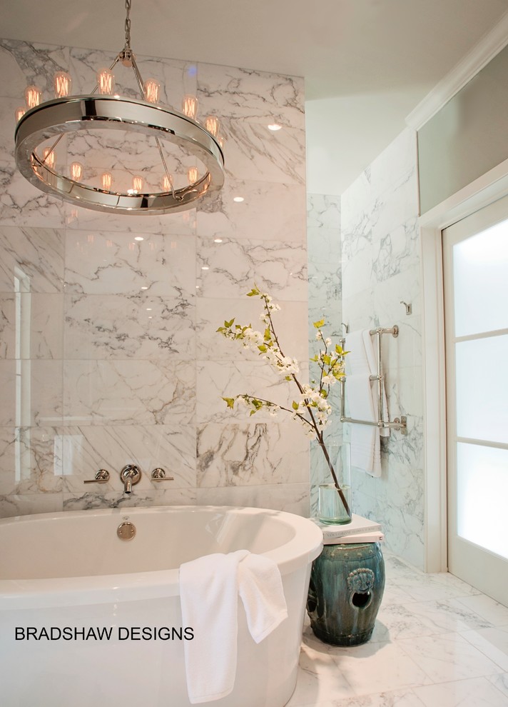 Photo of a large modern master bathroom in Austin with an undermount sink, flat-panel cabinets, medium wood cabinets, marble benchtops, a freestanding tub, a curbless shower, white tile, stone tile, grey walls and marble floors.