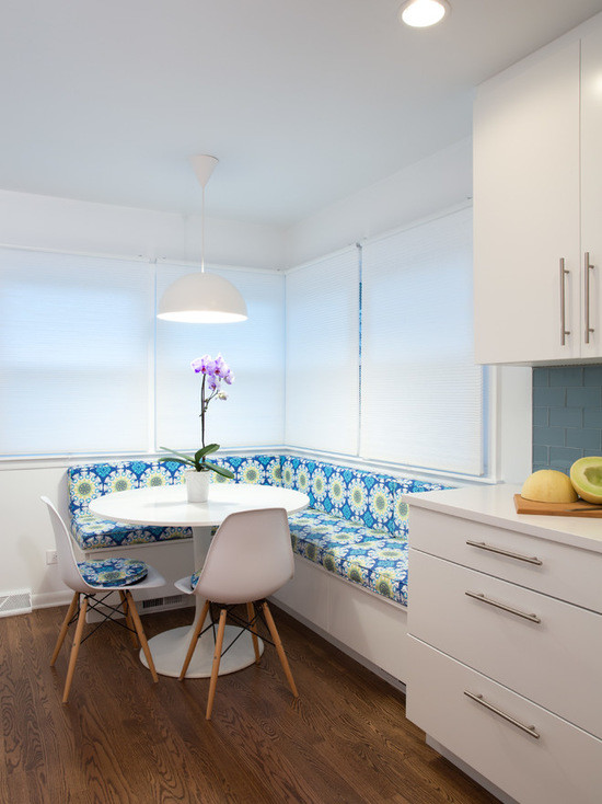 Mid-sized modern galley eat-in kitchen in Chicago with an undermount sink, flat-panel cabinets, white cabinets, copper benchtops, blue splashback, subway tile splashback, stainless steel appliances, medium hardwood floors and no island.
