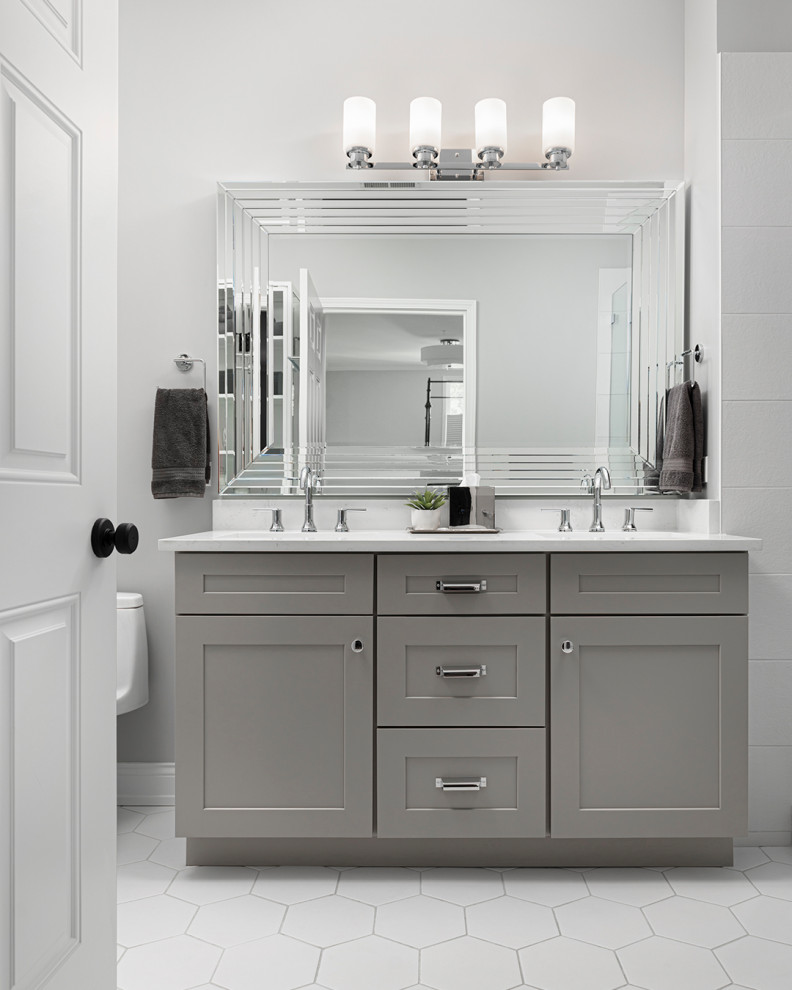 Mid-sized transitional master white tile and porcelain tile porcelain tile, white floor and double-sink alcove shower photo in Chicago with shaker cabinets, gray cabinets, gray walls, an undermount sink, quartz countertops, a hinged shower door, white countertops, a niche and a floating vanity