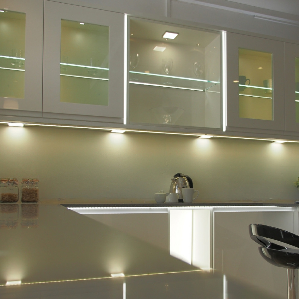 Eat-in kitchen - large modern l-shaped eat-in kitchen idea in Chicago with an undermount sink, recessed-panel cabinets, white cabinets, marble countertops, no island and gray countertops