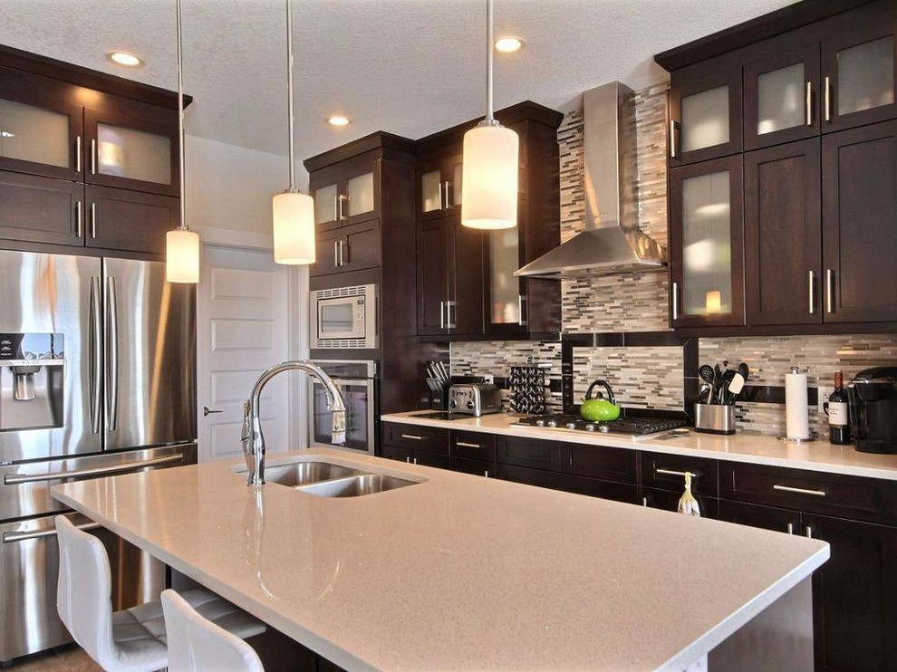 Example of a transitional kitchen design in Calgary