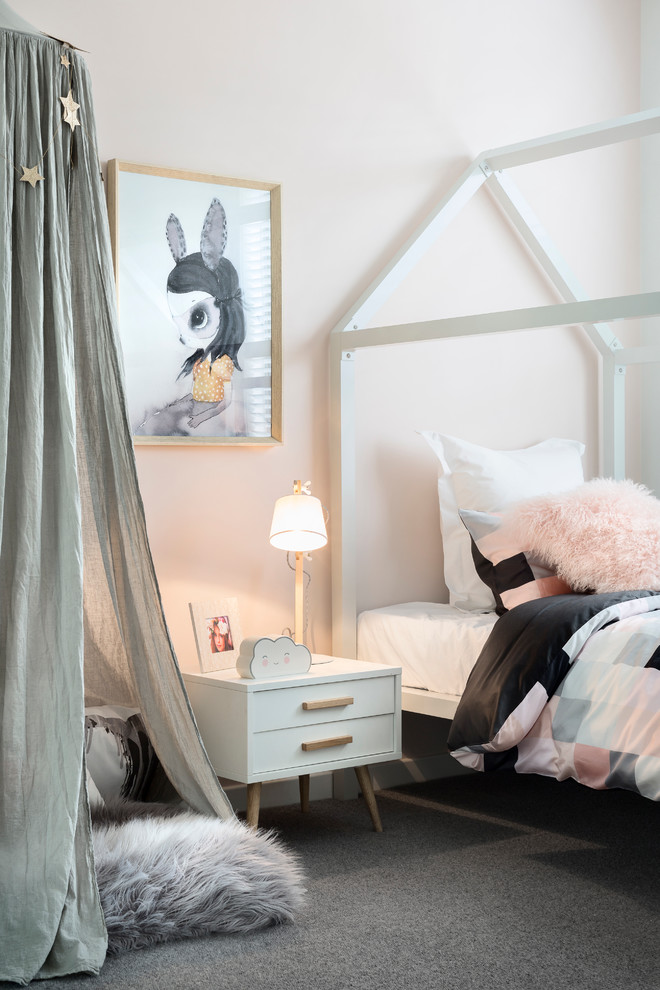 Scandinavian kids' bedroom in Melbourne with pink walls and carpet for kids 4-10 years old and girls.
