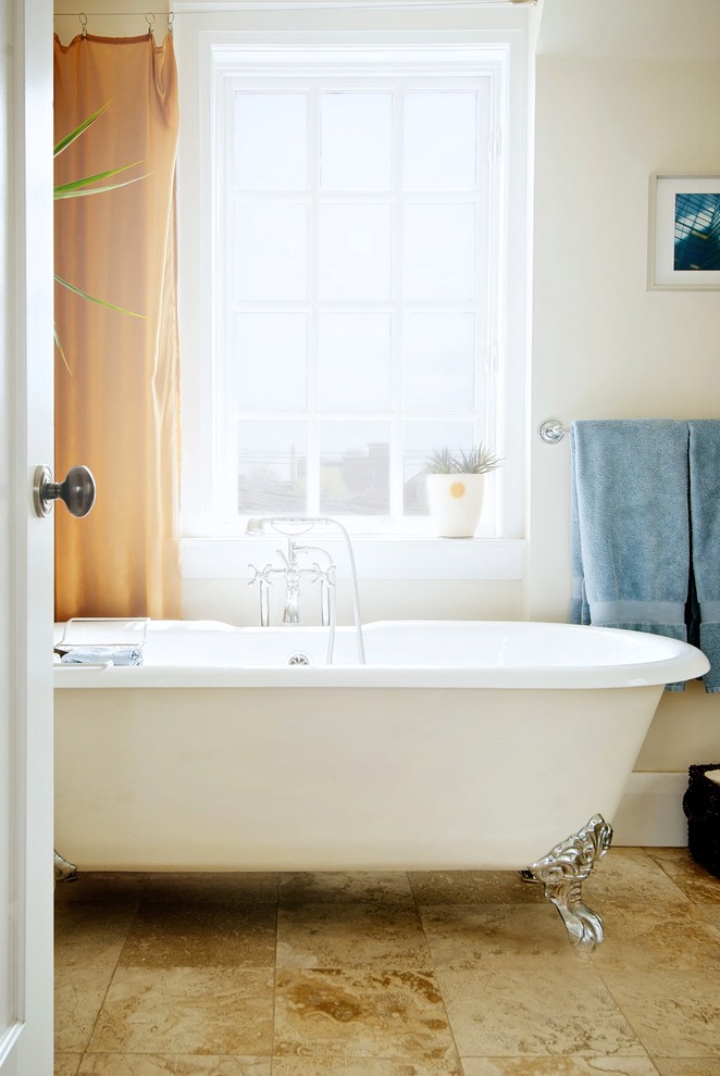 Design ideas for a transitional bathroom in Toronto with a claw-foot tub.