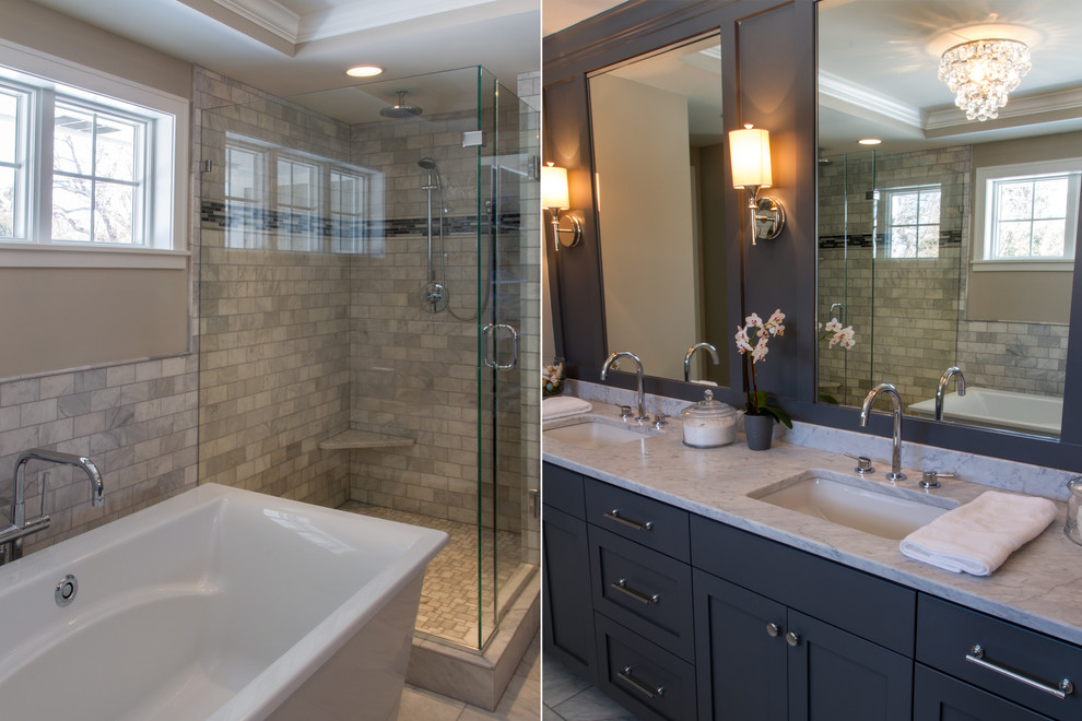 Photo of a large traditional 3/4 bathroom in Minneapolis with an undermount sink, recessed-panel cabinets, black cabinets, limestone benchtops, a freestanding tub, a corner shower, a one-piece toilet, white tile, stone tile, black walls and porcelain floors.
