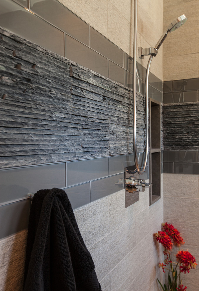 Small trendy gray tile and porcelain tile porcelain tile doorless shower photo in Dallas with flat-panel cabinets, black cabinets and gray walls