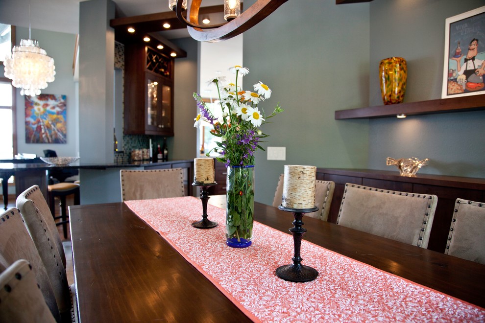 Example of a small transitional travertine floor and beige floor great room design with blue walls and no fireplace