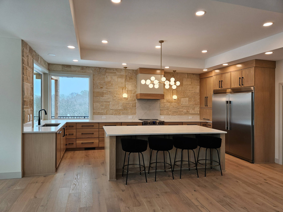 Eat-in kitchen - large u-shaped medium tone wood floor and tray ceiling eat-in kitchen idea with an undermount sink, recessed-panel cabinets, medium tone wood cabinets, quartz countertops, beige backsplash, quartz backsplash, stainless steel appliances, an island and beige countertops