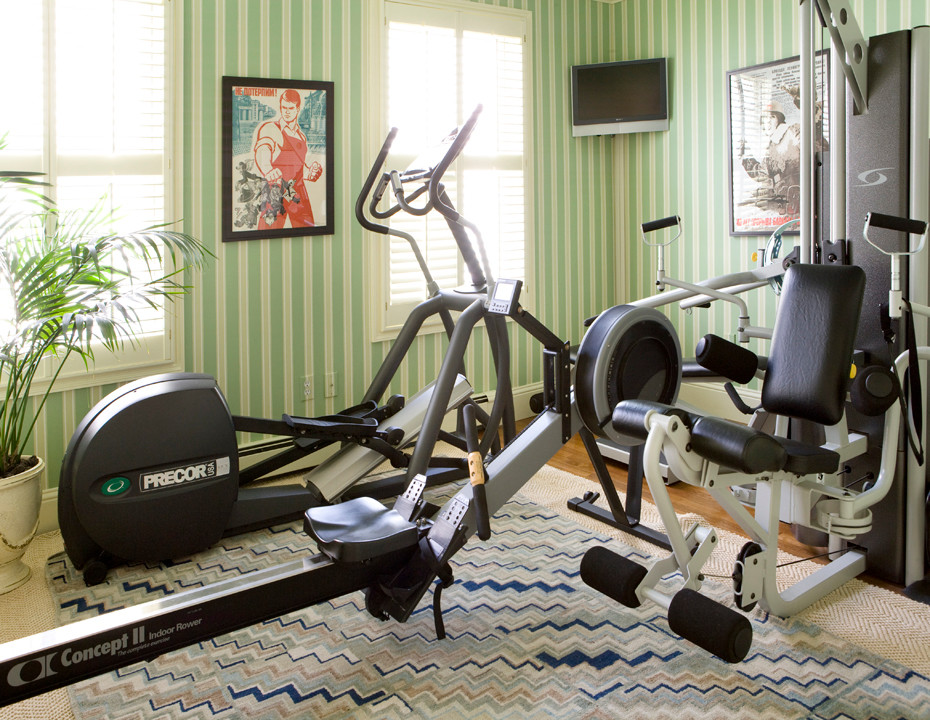 Small transitional home weight room in Boston with green walls and carpet.