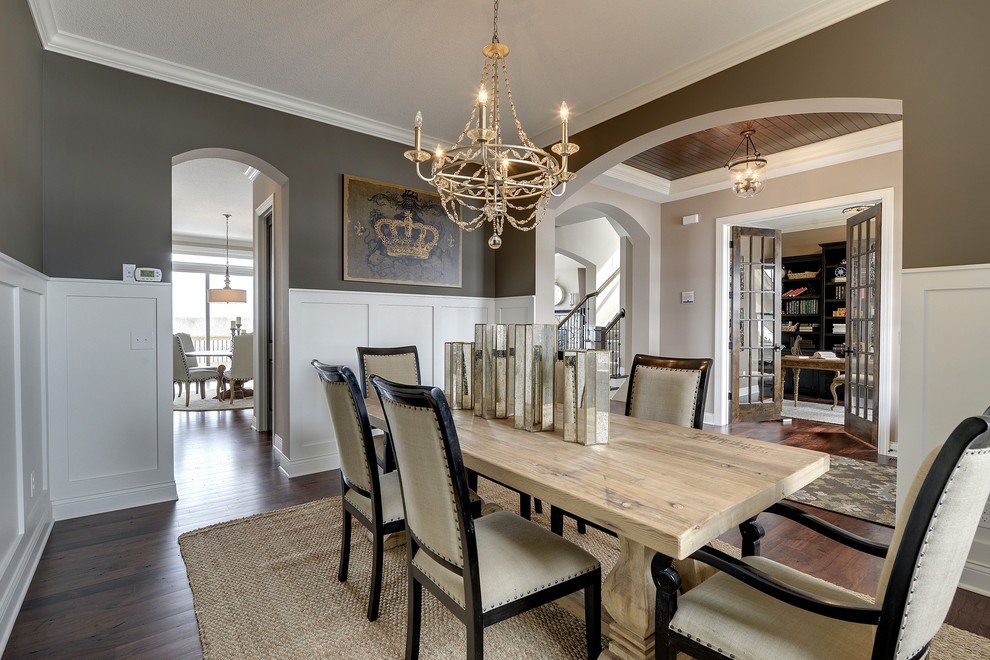 Large traditional separate dining room in Minneapolis with grey walls, dark hardwood floors and no fireplace.