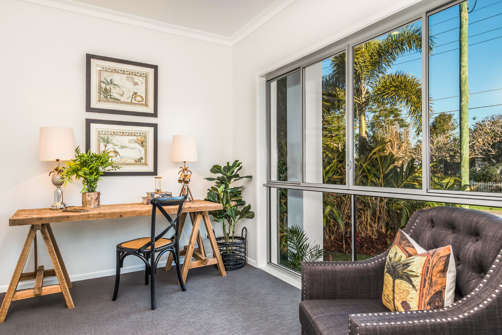 Tropical study room in Brisbane with white walls, carpet and a freestanding desk.