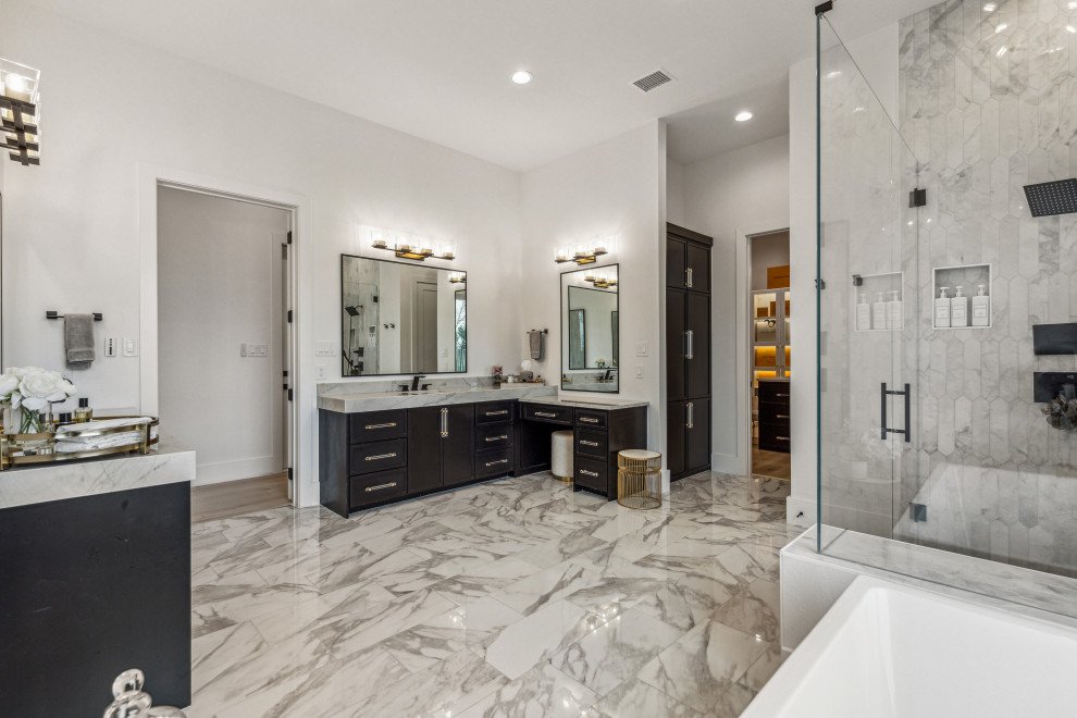Photo of a large contemporary master bathroom in Dallas with shaker cabinets, black cabinets, a freestanding tub, a curbless shower, a one-piece toilet, gray tile, marble, white walls, marble floors, an undermount sink, quartzite benchtops, grey floor, a hinged shower door, grey benchtops, a shower seat, a double vanity and a built-in vanity.