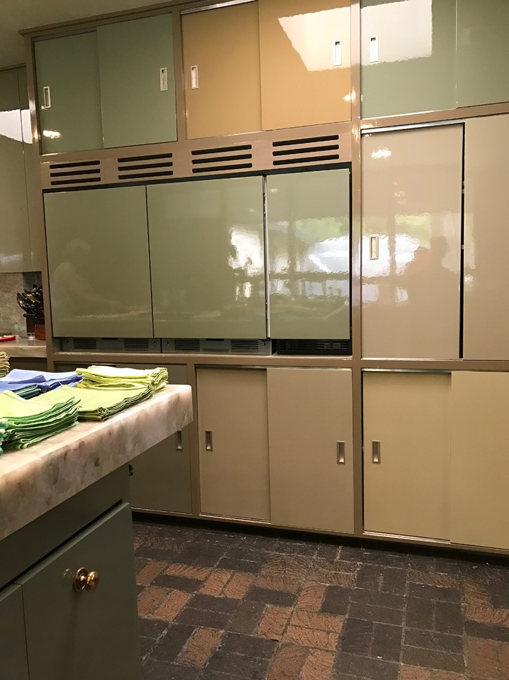 Photo of a large midcentury u-shaped separate kitchen in Dallas with an undermount sink, flat-panel cabinets, beige cabinets, quartzite benchtops, green splashback, marble splashback, panelled appliances, brick floors, with island, multi-coloured floor and green benchtop.