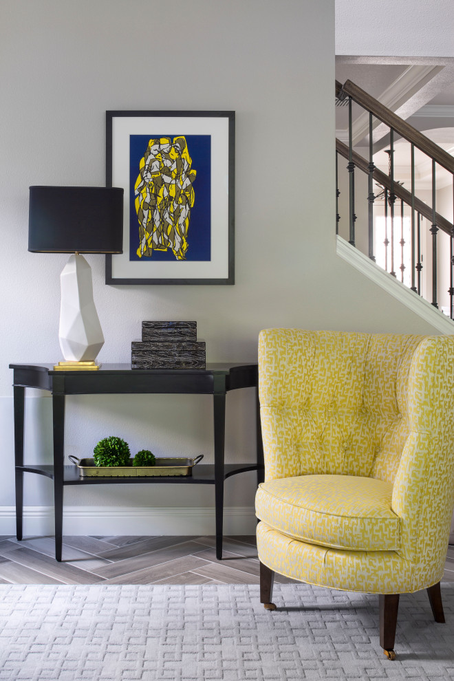 Painted Ladies Stained Glass Art - The painted ladies artwork was one of the first pieces the client purchased for their new home.  The bold navy background and bright yellow figures inspired the colors we chose for room.  A pair of custom yellow tub chairs are the perfect cozy spot to relax.