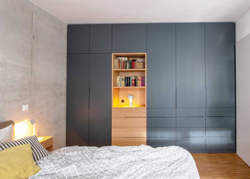 Medium sized contemporary master bedroom in Munich.