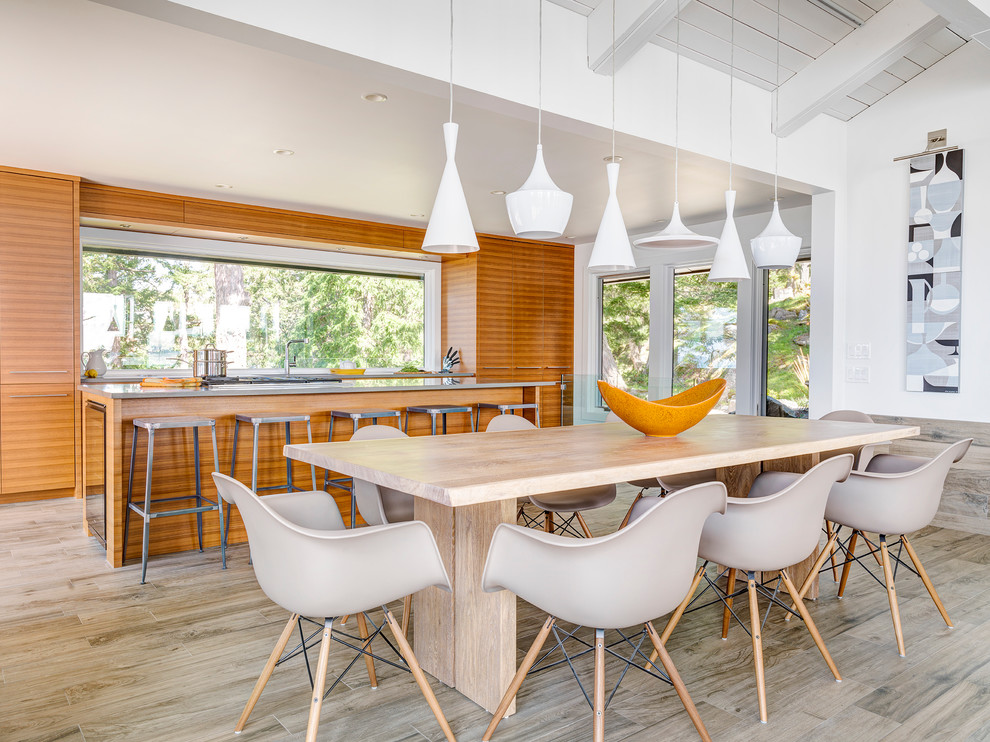Beach style kitchen/dining combo in Vancouver with white walls.