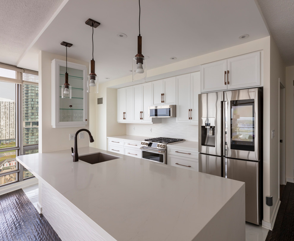 Example of a transitional kitchen design in Toronto