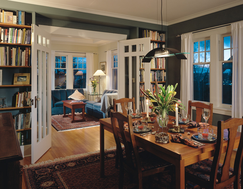 This is an example of a traditional dining room in Seattle with green walls.