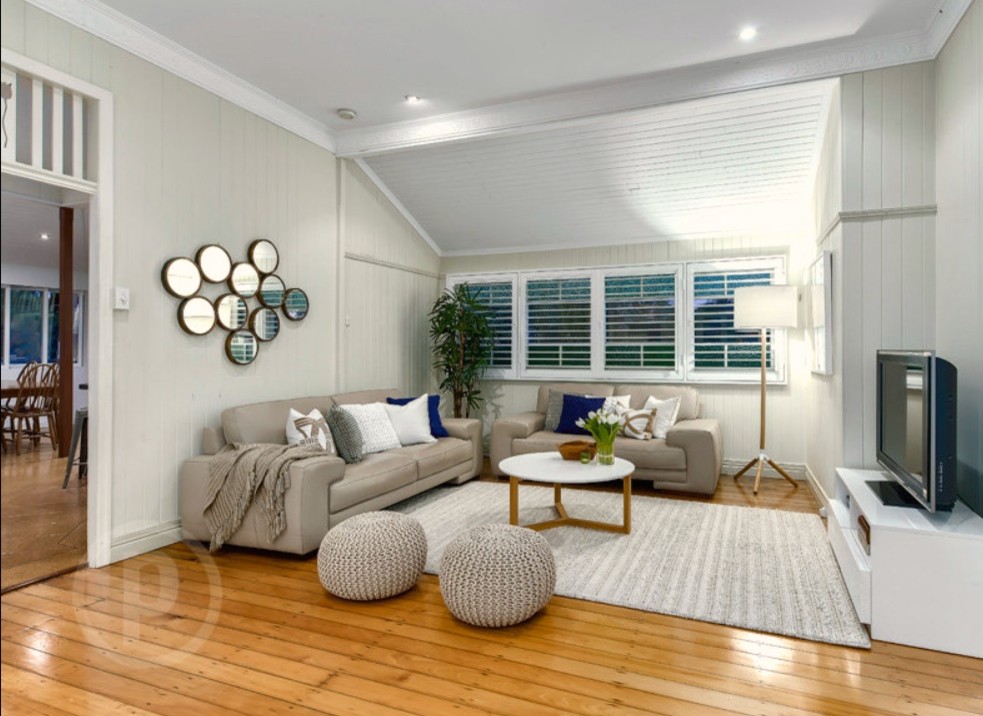 Photo of a large transitional open concept living room in Brisbane with beige walls, medium hardwood floors, no fireplace and a freestanding tv.