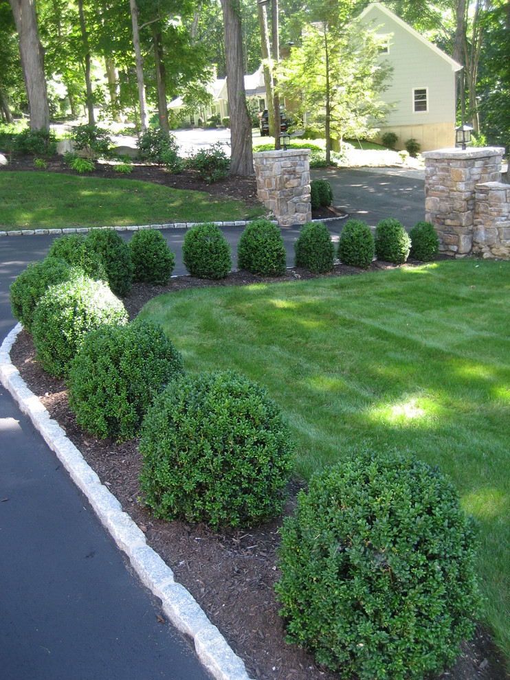 This is an example of a traditional front yard driveway in New York.