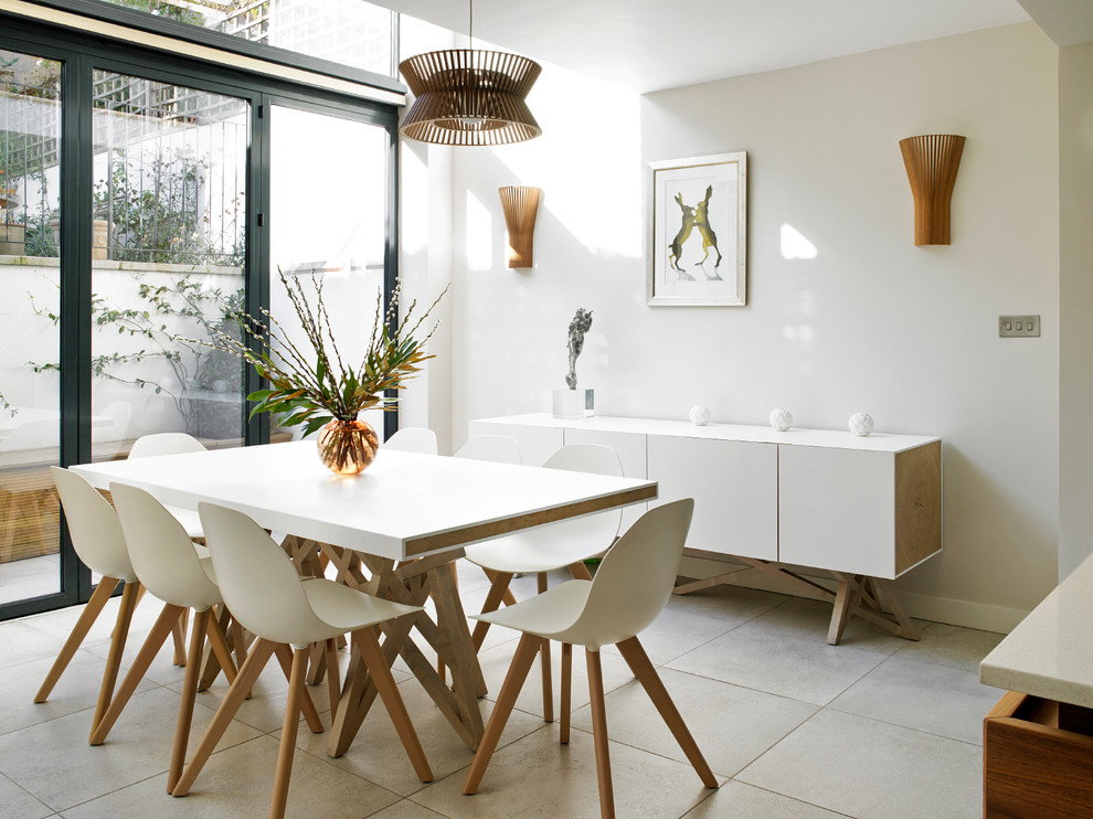 This is an example of a contemporary kitchen/dining combo in London.