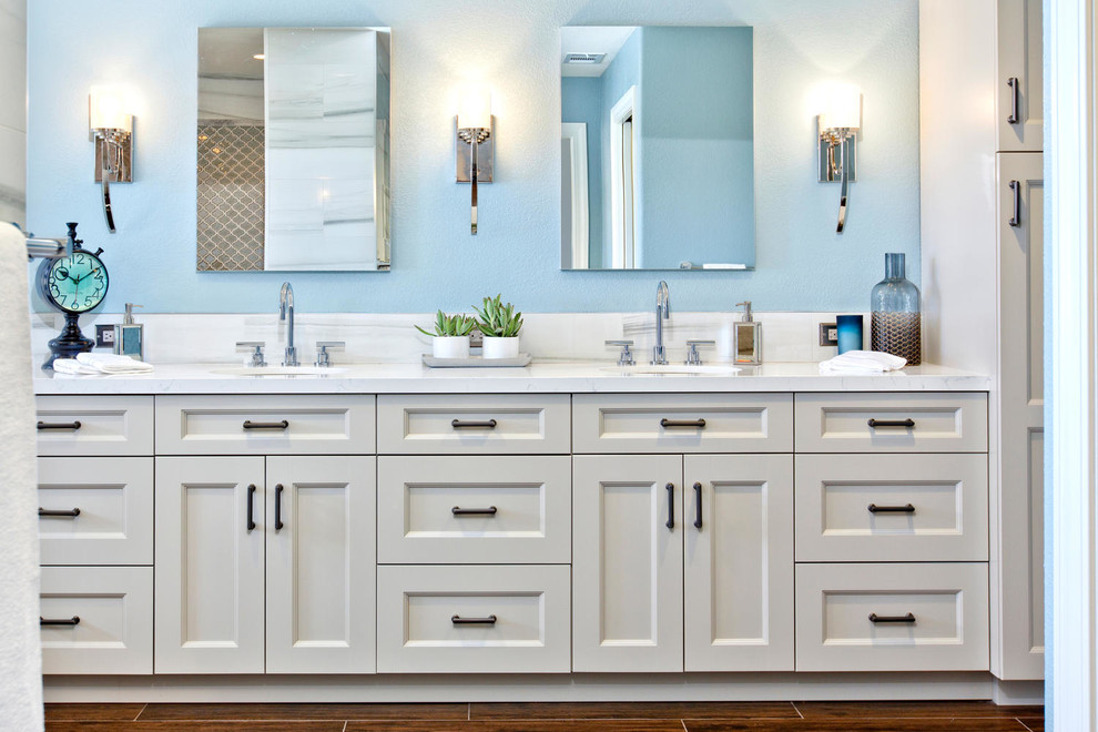 Large traditional master bathroom in Denver with recessed-panel cabinets, white cabinets, a freestanding tub, an open shower, a wall-mount toilet, yellow tile, porcelain tile, blue walls, porcelain floors, an undermount sink and engineered quartz benchtops.
