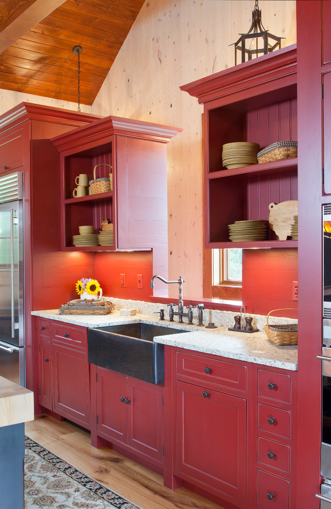 Inspiration for a country single-wall eat-in kitchen in DC Metro with a farmhouse sink, flat-panel cabinets, red cabinets, granite benchtops, red splashback, stone slab splashback and stainless steel appliances.
