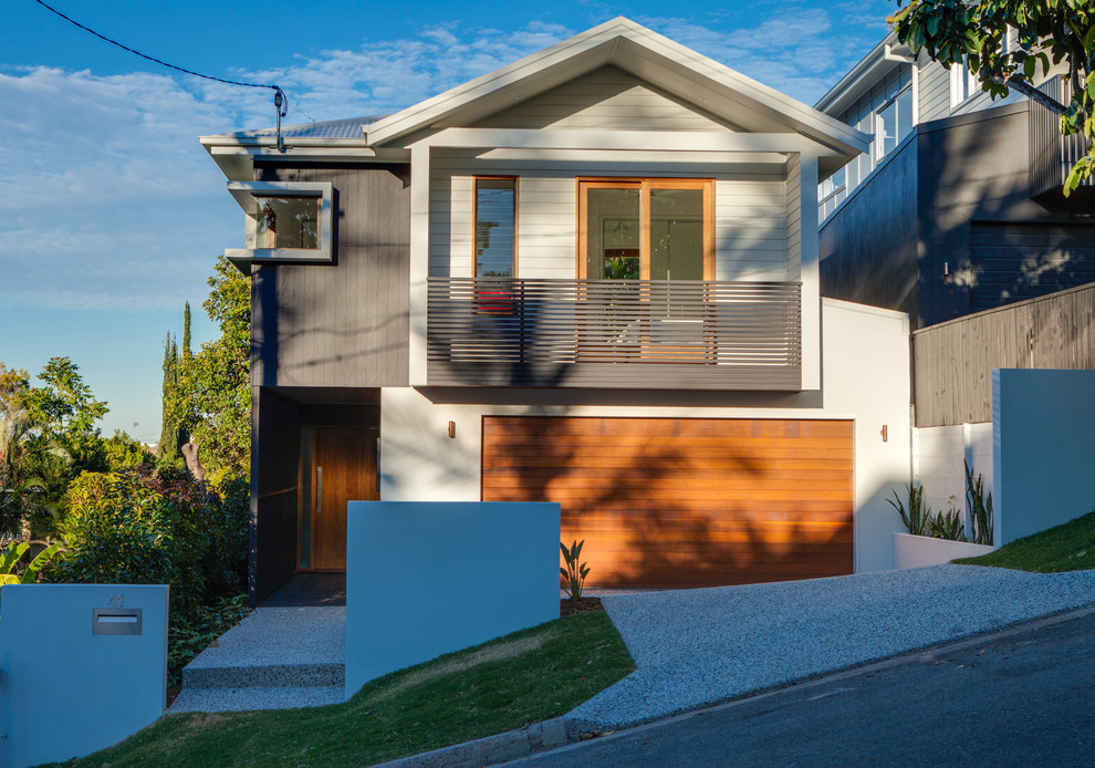 This is an example of a transitional two-storey exterior in Brisbane with mixed siding.
