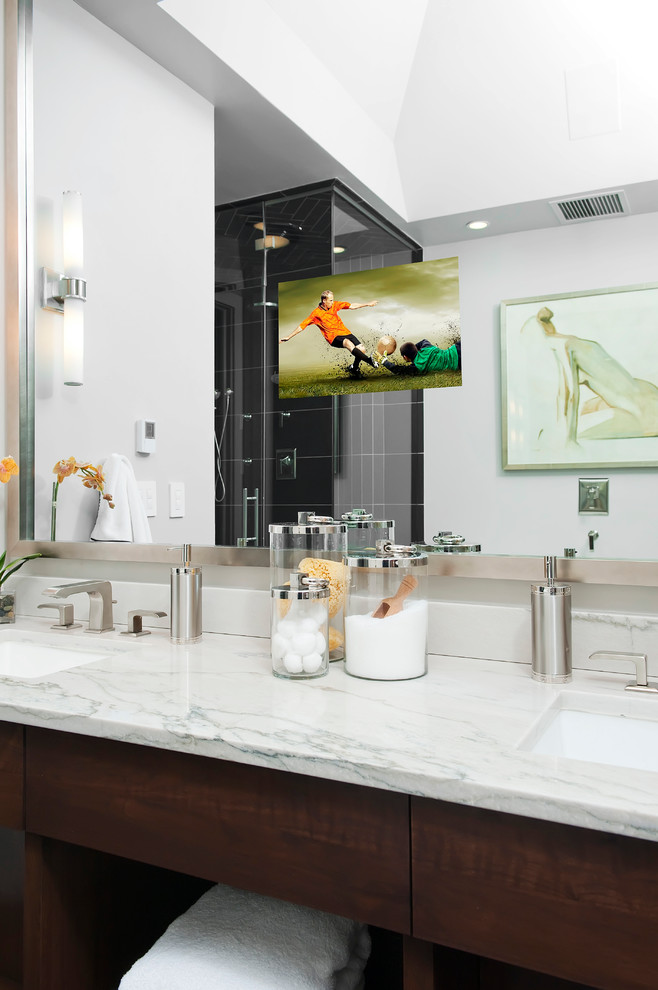 Design ideas for a mid-sized transitional master bathroom in Denver with open cabinets, dark wood cabinets, a freestanding tub, a double shower, a two-piece toilet, black tile, stone tile, grey walls, limestone floors, an undermount sink and quartzite benchtops.