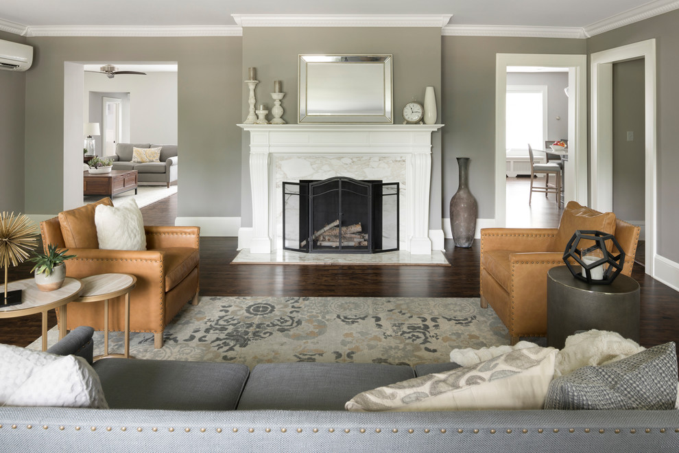 Design ideas for a mid-sized transitional open concept living room in Minneapolis with white walls, dark hardwood floors, a standard fireplace, a stone fireplace surround, a wall-mounted tv and brown floor.